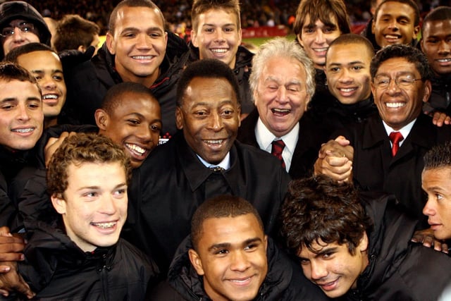 The joy of Pele is reflected in this picture as the Brazilian great poses with the President of Sao Paulo and their under 17 side at Bramall Lane (AP Photo/Simon Dawson)