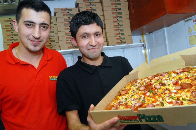 Staff at the Snappy Tomato Extra pizza shop in 2012