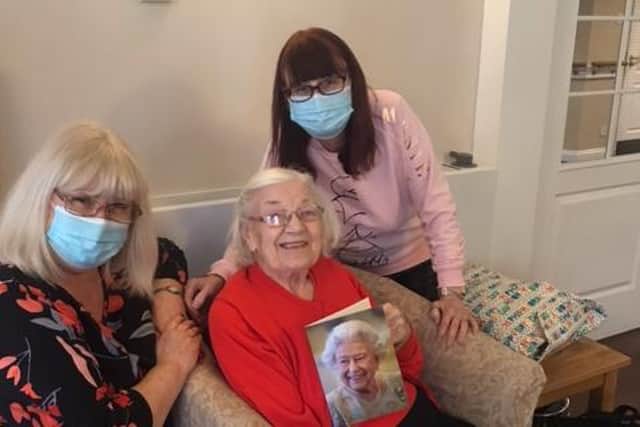 Marion Hedley celebrates her 100th birthday with her daughters Ann and Marilyn.