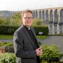 The Venerable Mark Wroe, pictured by the Royal Border Bridge, is the next Suffragan Bishop of Berwick.