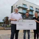 Lewis Hegarty (L) and Annabel Skillings (R) from The Seaburn Inn presenting Ryan Glymond (centre) with his Give Inn Back donation.