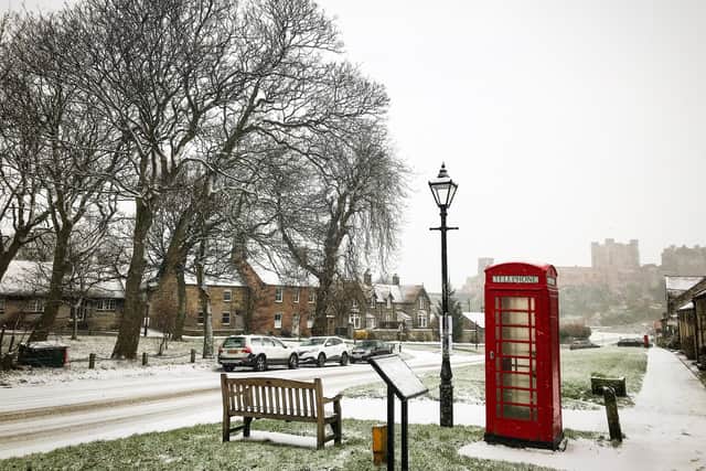 The red phone box takes pride of place in a chocolate box-style winter scene by Katy Wheeler