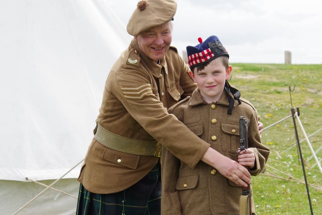 Nine-year-old Jack Mason from Byth gets dressed up as a WW1 Gordon Highlander with help from Sgt Tom Greenshields.