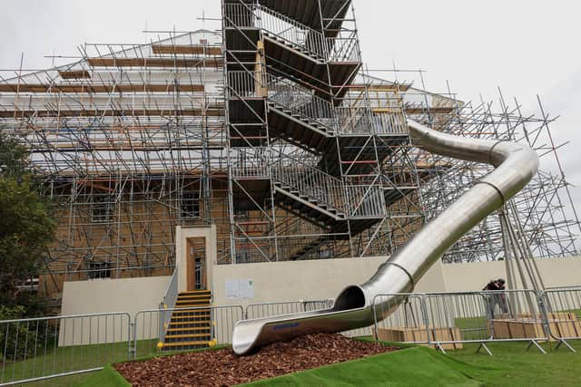 English Heritage staff test the new slide descending down the side of Belsay Hall, which is undergoing major renovation work as part of the multi-million pound Belsay Awakes project: North News & Pictures.