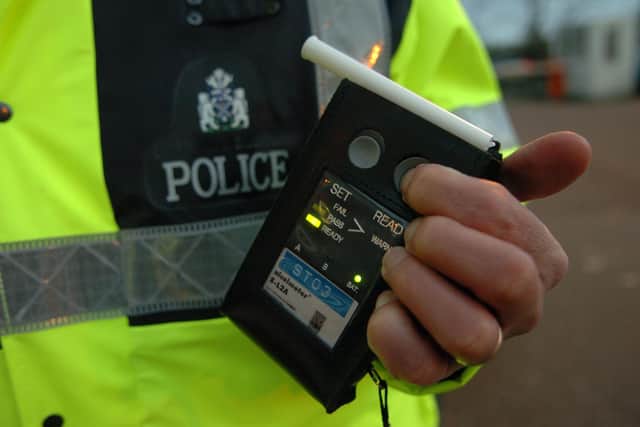 A driver has been arrested for drink driving following an incident involving a vehicle and two pedestrians.