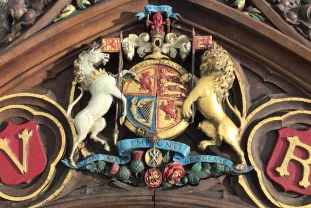 The royal crest on Queen Victoria's pew.