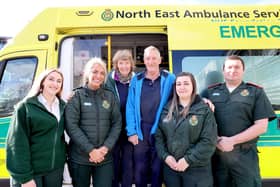 Chris Browitt and wife Alice with adviser Charlotte Saul, dispatcher Hollie Hicks, paramedic Louise Fawcus and specialist paramedic Graeme Cutty.