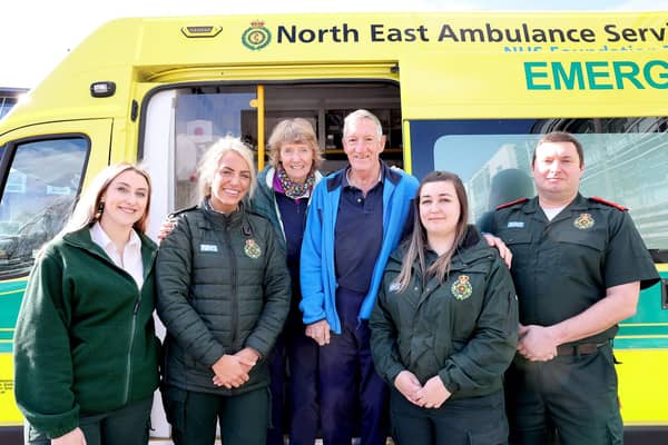 Chris Browitt and wife Alice with adviser Charlotte Saul, dispatcher Hollie Hicks, paramedic Louise Fawcus and specialist paramedic Graeme Cutty.