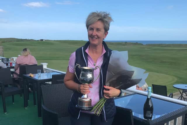 Anne Locke with her trophy after winning the Seahouses Golf Club ladies championship for the 25th time.