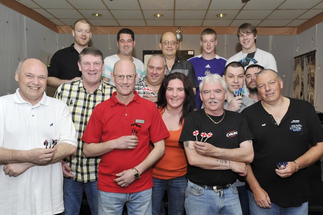 Some of the players in a charity darts event at the Radcliffe Club in 2011.