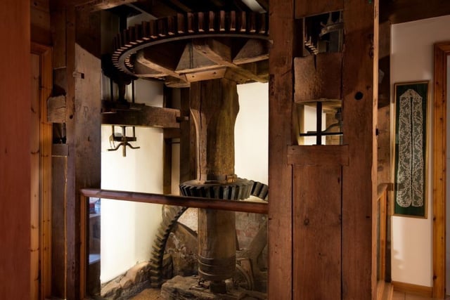 The original wooden mill machinery is still an integral part of the home.
