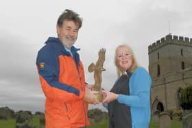 Reverend Louise Taylor-Kenyon of St Aidan’s Parish Church, Bamburgh and Patrick Norris, Chair of the Northumberland Coast AONB with the Bowland Award outside St Aidan’s. Photo: Rachel Norris