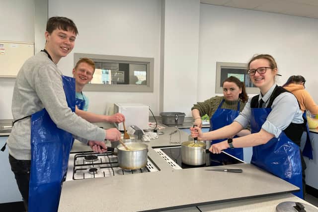 Catering students making cottage pie.