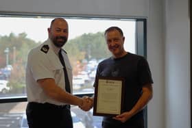 ACC Scott Young presents Sean Parker with an award in recognition of his actions that day. (Photo by Northumbria Police)