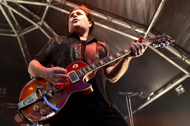 Guitarist Charlie Burchill, one of the founder members of Simple Minds, rocks out at the Alnwick Castle concert in the Pastures in 2014.
