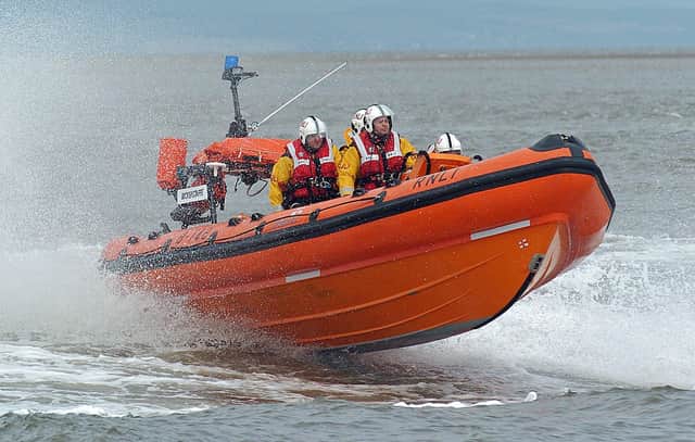 Inshore Lifeboat assist in rescue of injured woman under harsh weather conditions