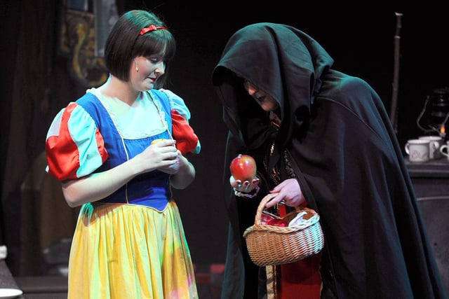 Evil Queen Avarice (Diane Renner) planning to poison Snow White ()Amy Cowan with an apple in the Spittal Variety Group pantomime.