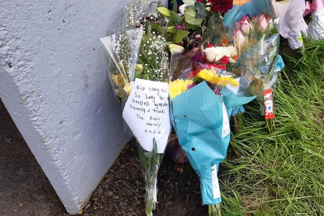 Floral tributes left after Danny Humble was attacked near Romsey Close, Cramlington.