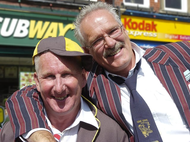 Two 'schoolboys' pose for the camera.
