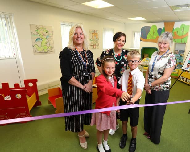 Maureen Taylor, interim executive director of education at Northumberland County Council, illustrator, Liz Million and Alison Peaden, head of service for libraries with pupils from St Bede’s Catholic Primary School at the official launch of Bedlington Library and Community Hub.