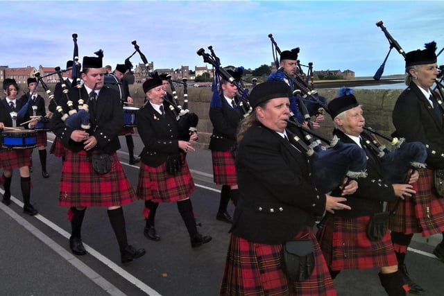 The British Legion Pipe Band leading the procession to Tweedmouth over the Old Bridge.