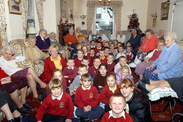 Red Row First School sing Christmas Carols for the elderly in Heatherdale Residential Home in Red Row in December 2003.