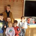 Scremerston First School headteacher Sarah Smith and some of the children with their new bamboo toothbrushes.