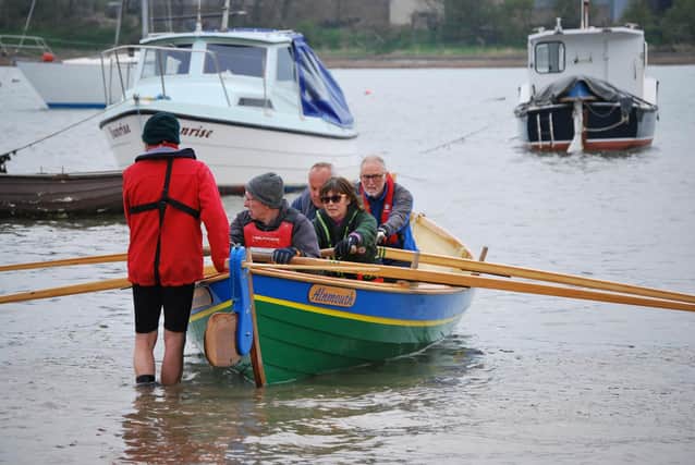 The Pride of the Aln about to launch. Members built the skiff themselves. Picture: Alnmouth Community Rowing
