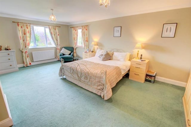 The main bedroom is large, running the full depth of the house above the lounge.