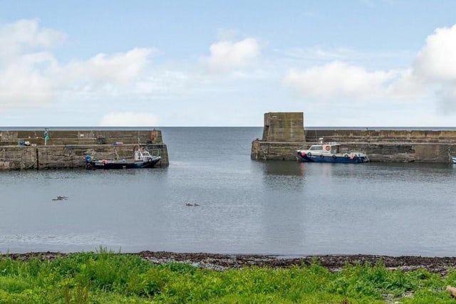 The view of Craster harbour.
