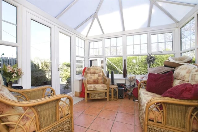 The generous conservatory area has direct access to a beautifully landscaped private garden.
