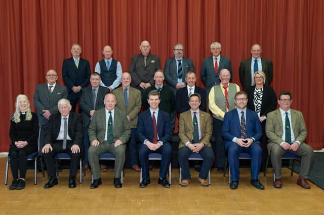Long service award recipients and organisation representatives. Picture by Hector Innes.
