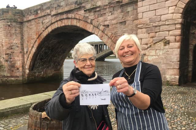 Margaret Shaw, chair of Bridge 400, and Ruth Forrest of The Lookout with one of the postcards. Picture by Alan Hughes.