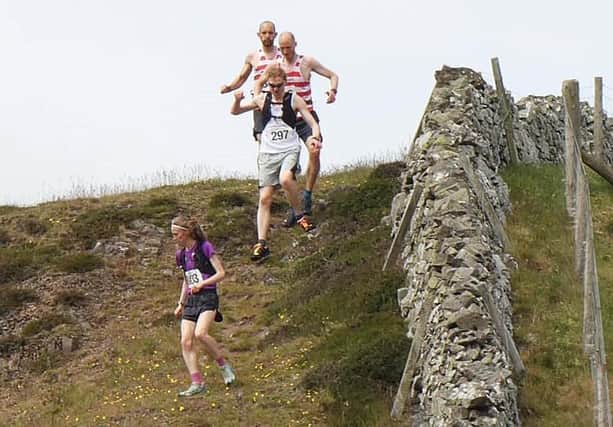 Runners including Cat Macdonald in action in the Yetholm Hill Race at the weekend.