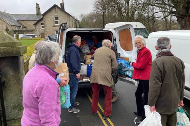 Donations made in Rothbury are packed into a van.