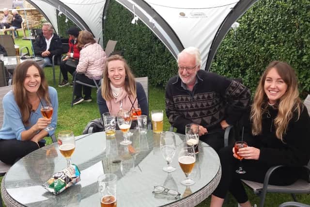 Milly Bellotti, Charlotte Spedding, John Taylor and Helen Taylor socialising in the beer garden of The Red Lion in Alnmouth.
