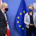 Boris Johnson (L) welcomed by European Commission President Ursula von der Leyen (R) in the Berlaymont building at the EU headquarters in Brussels on December 9, 2020, prior to a post-Brexit talks' working dinner.