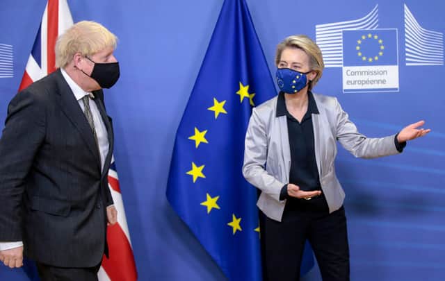 Boris Johnson (L) welcomed by European Commission President Ursula von der Leyen (R) in the Berlaymont building at the EU headquarters in Brussels on December 9, 2020, prior to a post-Brexit talks' working dinner.