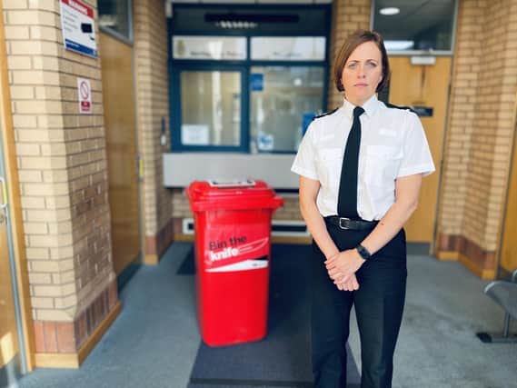 Chief Supt Helena Barron with a knife surrender bin.