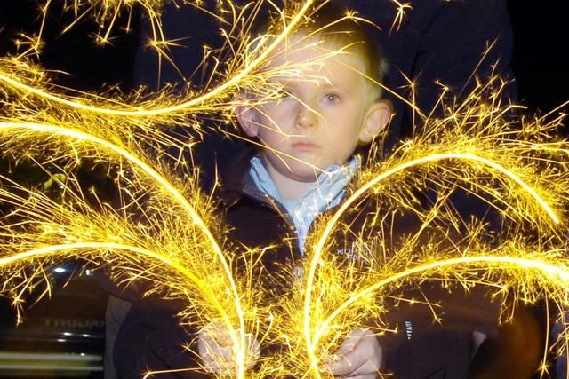 Owen Wilcox enjoys lighting up the night with his sparklers.
