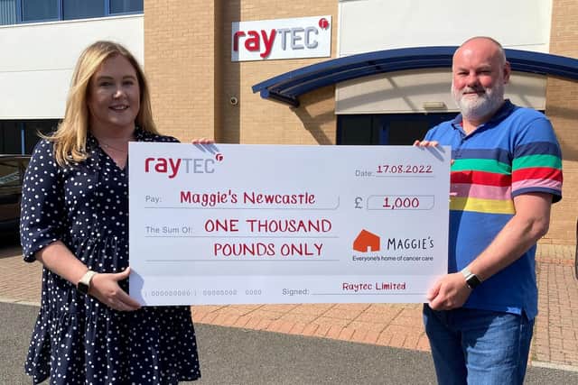 Barry Thompson from Raytec hands over the cheque to Jess Maguire of Maggie's.