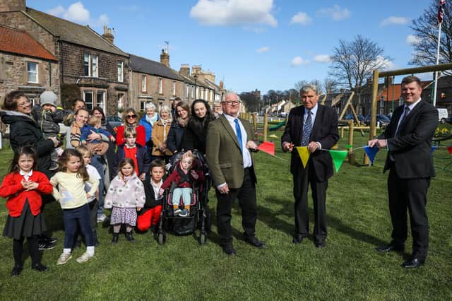 A group of Norham residents with, from left, Coun Colin Hardy, David McCreath and Gareth Greenwood at the official opening of the new play area.