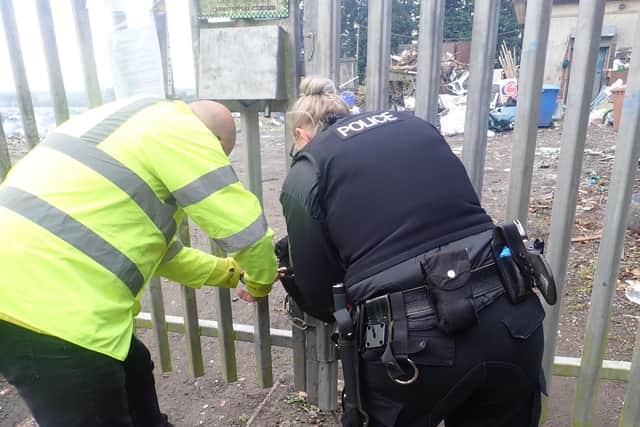 Environment Agency and Northumbria Police locking the gates to the site.