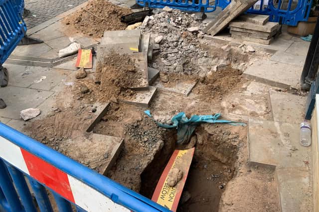 Northern Powergrid dug a hole in Alnwick Market Place to find the fault.