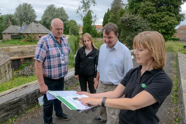 Kirsty Harwood, Environment Agency Project Manager, highlights an aspect of the Ponteland flood scheme to, from left, Ponteland North county councillor Richard Dodd, Leila Huntington, Environment Agency, and Guy Opperman MP. Picture courtesy of North News and Pictures.