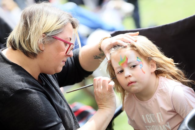 One youngster gets her face painted.