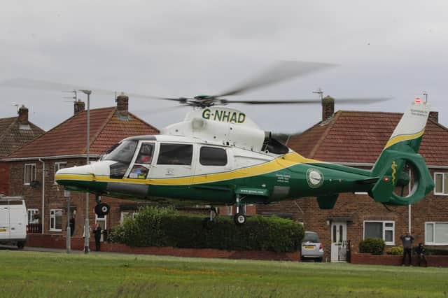 The Great North Air Ambulance landing in Stead Lane, Bedlington, after a woman was shot with an air gun. Picture by A. Old.