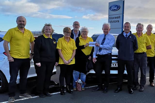 Members of the Berwick and District Cancer Support Group with Maxwell Motors Berwick service manager Steven Murray (centre left) and dealer principal Cameron Angus (centre right). Picture by Roger Peaple. Full picture is in this week's paper (December 2 edition).