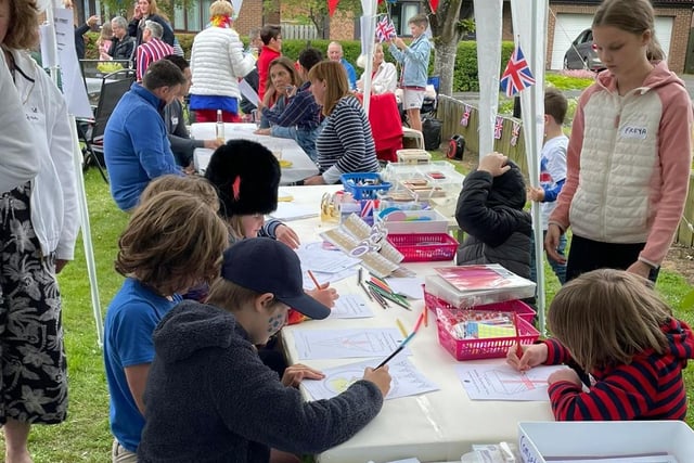 Youngsters enjoy colouring in.