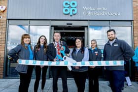 Mayor of Blyth Warren Taylor cut the ribbon on the new store alongside manager Kayleigh Davidson and some of the store team. (Photo: John Millard/UNP)